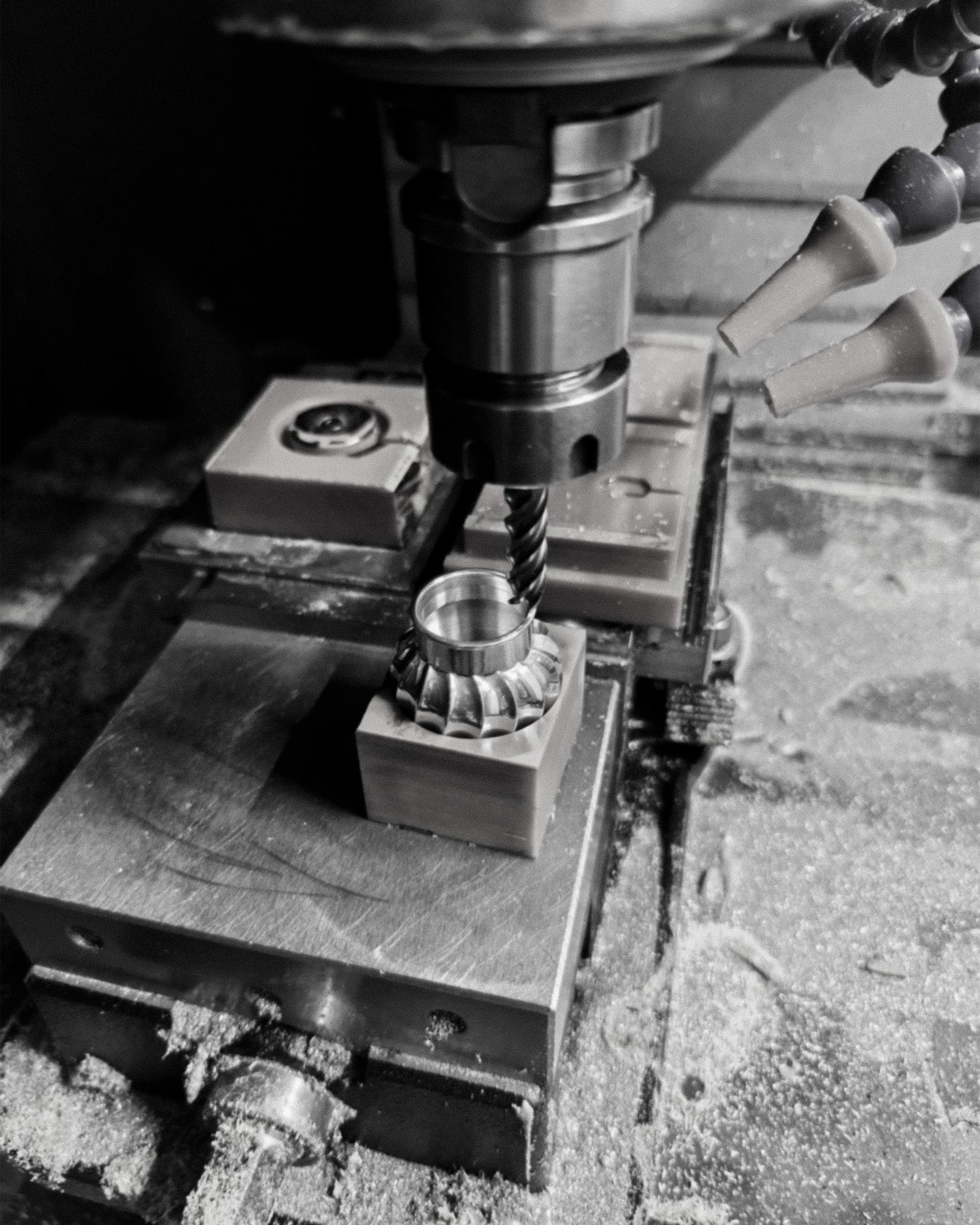 CNC machine in operation with Moëhr zinc cap being machined.